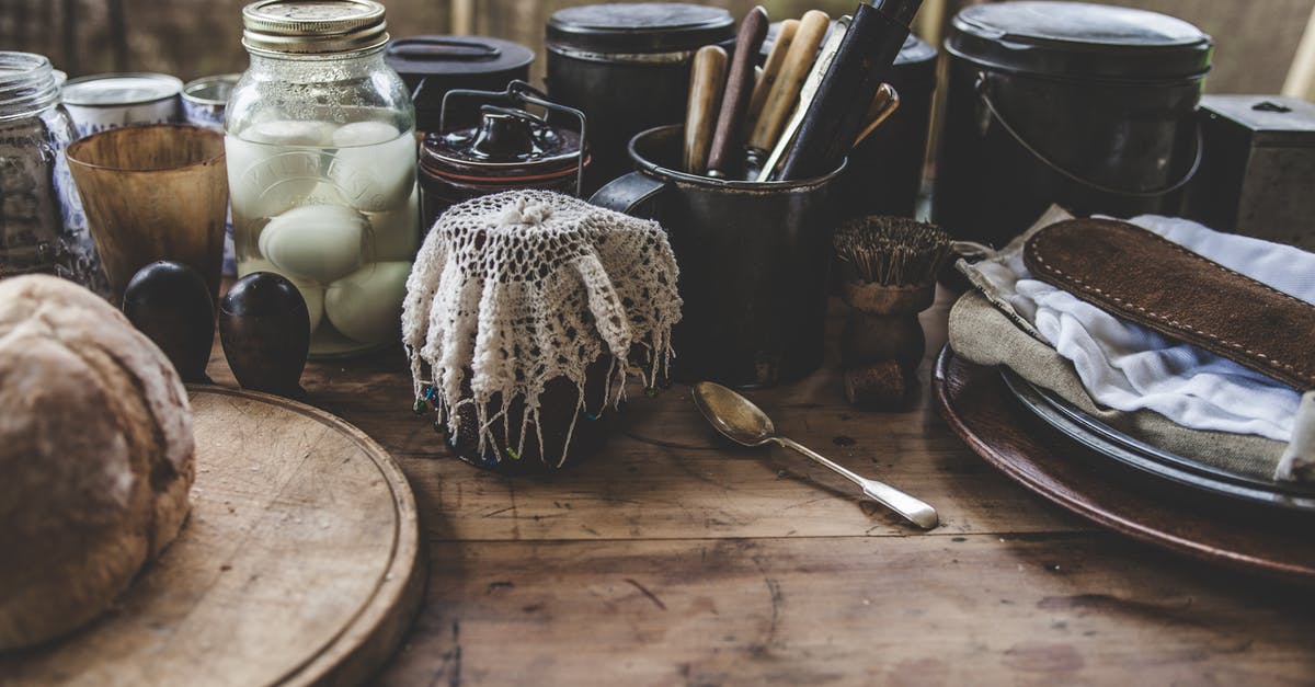 Pickled eggs in a jar. What counts? - Black Canister Placed on Top of Brown Wooden Surface