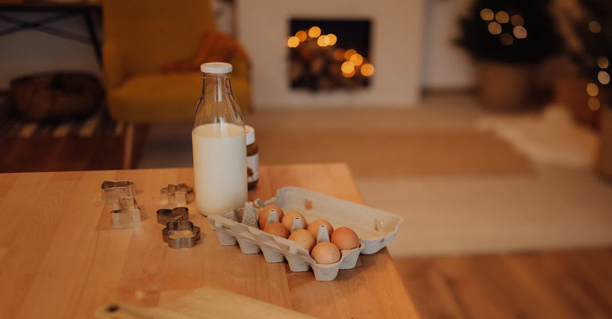 Pickled eggs in a jar. What counts? - Baking Ingredients and Tools on a Wooden Table