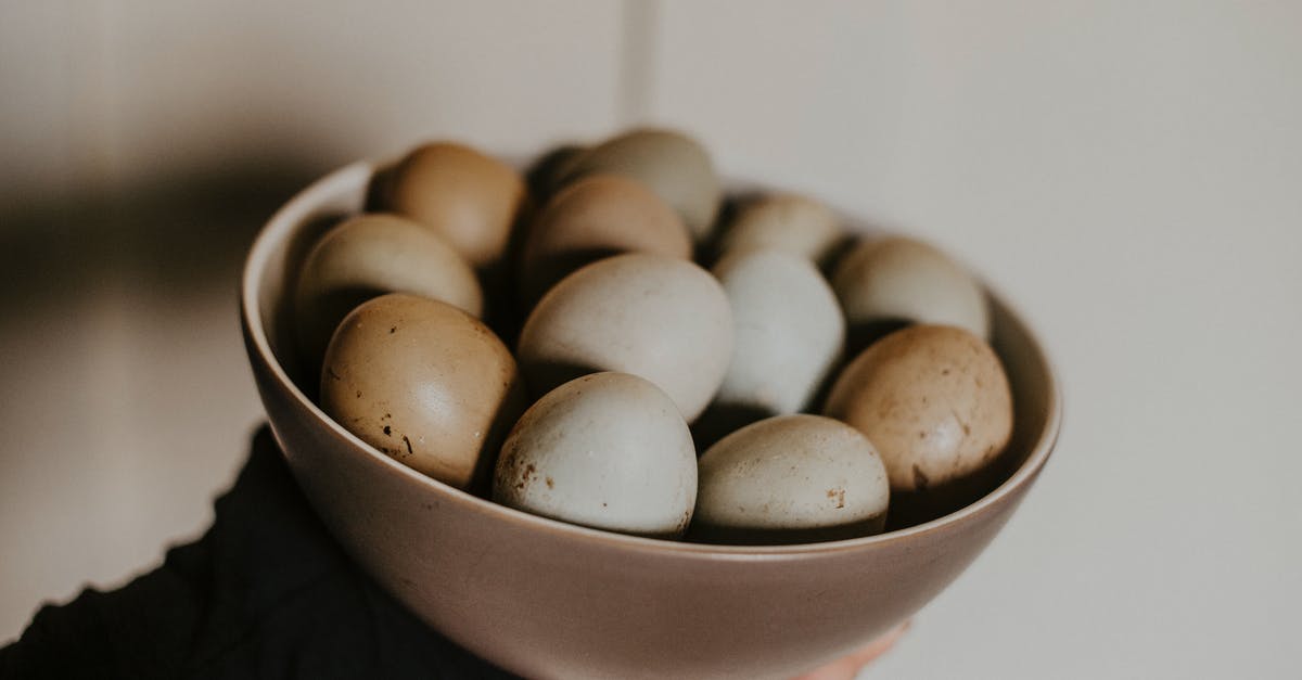 Pickled Eggs with slightly gooey yolks? - Person Holding Bowl of Eggs