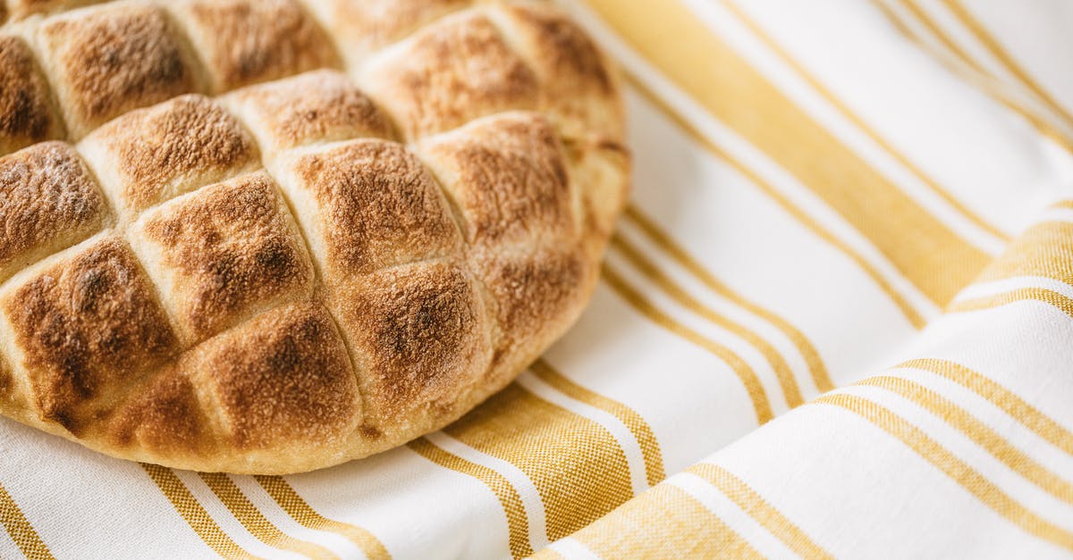 pita bread crust too hard - Homemade fresh baked bread on table