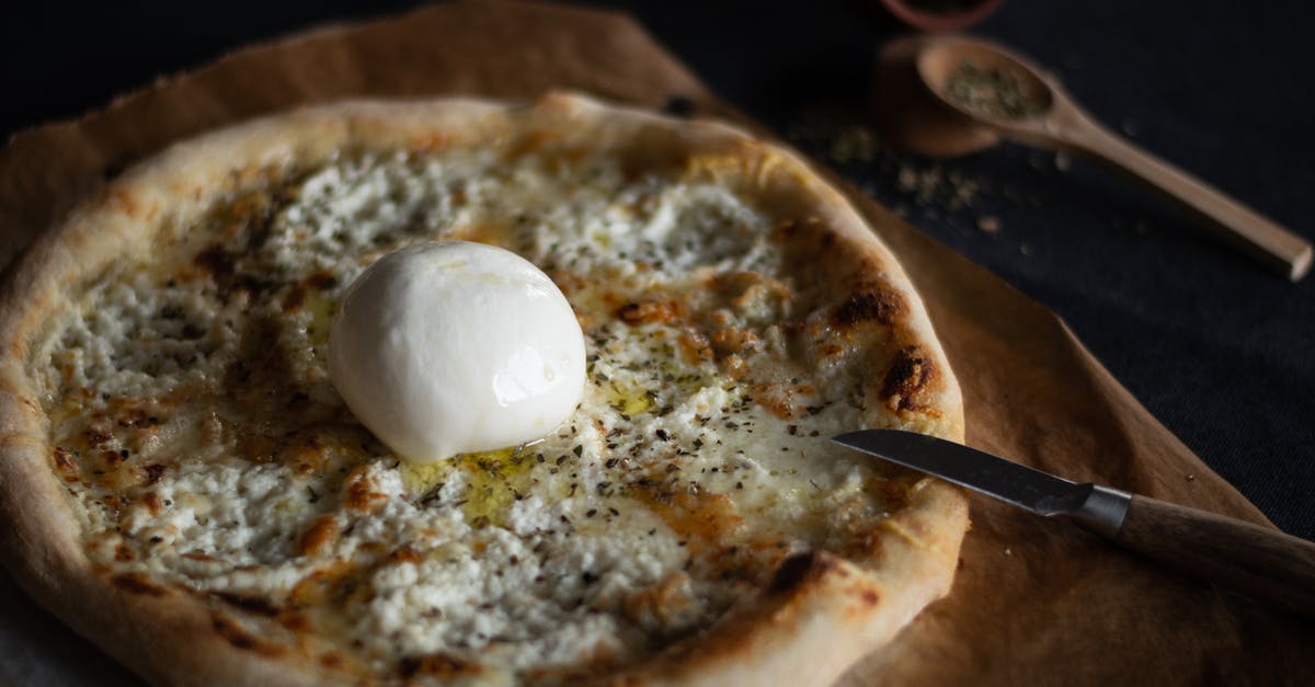 Pizza dough with sand paper texture? - Creamy Cheese Pizza in Close-up Shot