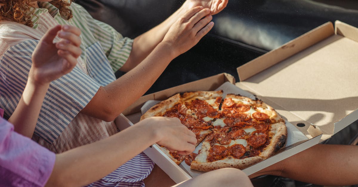 Pizza fries getting burnt - Women Eating Pizza on a Couch