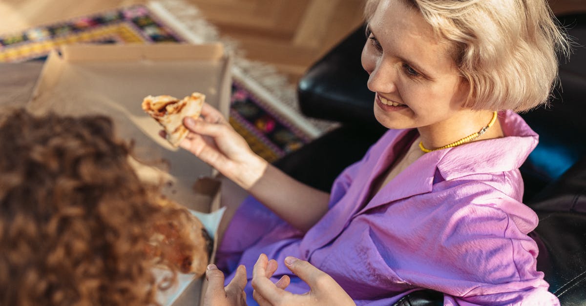 Pizza without yeast - Woman in Purple Button Up Shirt Holding Brown Bread