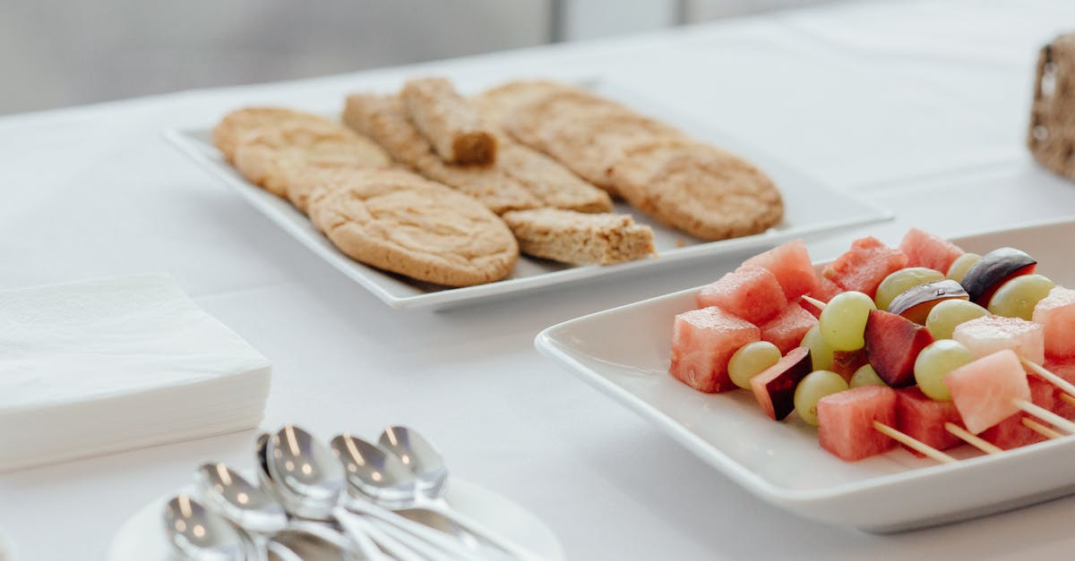 Plum preserving/storage method that tastes like plums, not prunes (I just picked 30 lbs) - Tasty cookies placed near plate with skewers of fresh watermelon plums and grapes served on table with cutlery in cafe