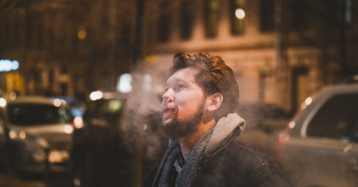 Polymer fume fever probably detected - Man in Black Jacket Standing Near Building during Night Time