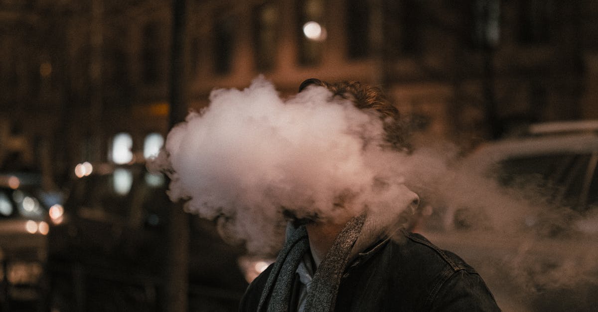 Polymer fume fever probably detected - Man in Black Jacket Smoking