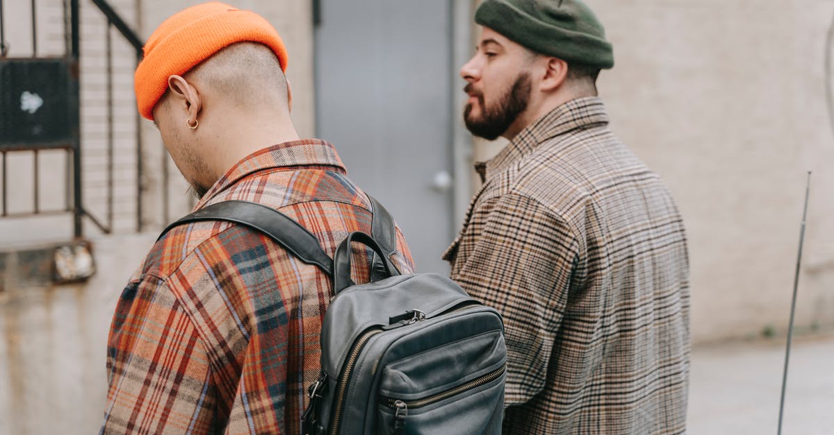 Popped lid in pressure canning - A Man in Orange Knit Cap Beside a Man in Green Knit Cap