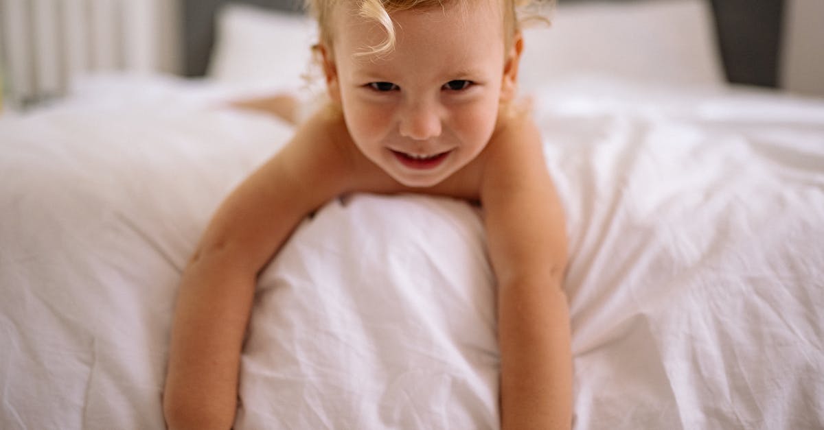 Pork didn't get done in time - Topless Baby Lying on Bed