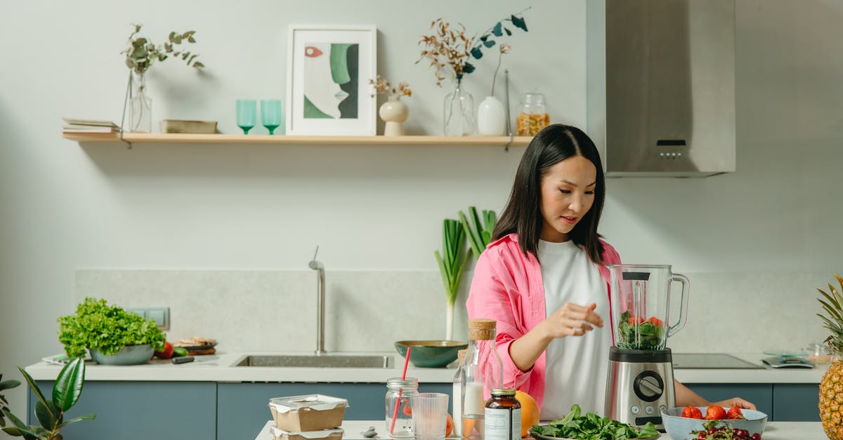 Possible dangers of home fermentation of vegetables - Woman Using a Blender