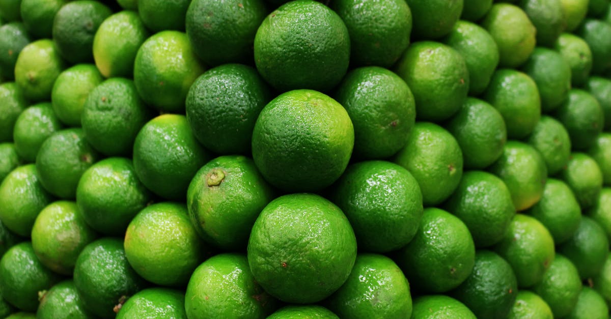 Post harvest treatment of organic limes vs conventional limes - Close-Up Shot of Limes