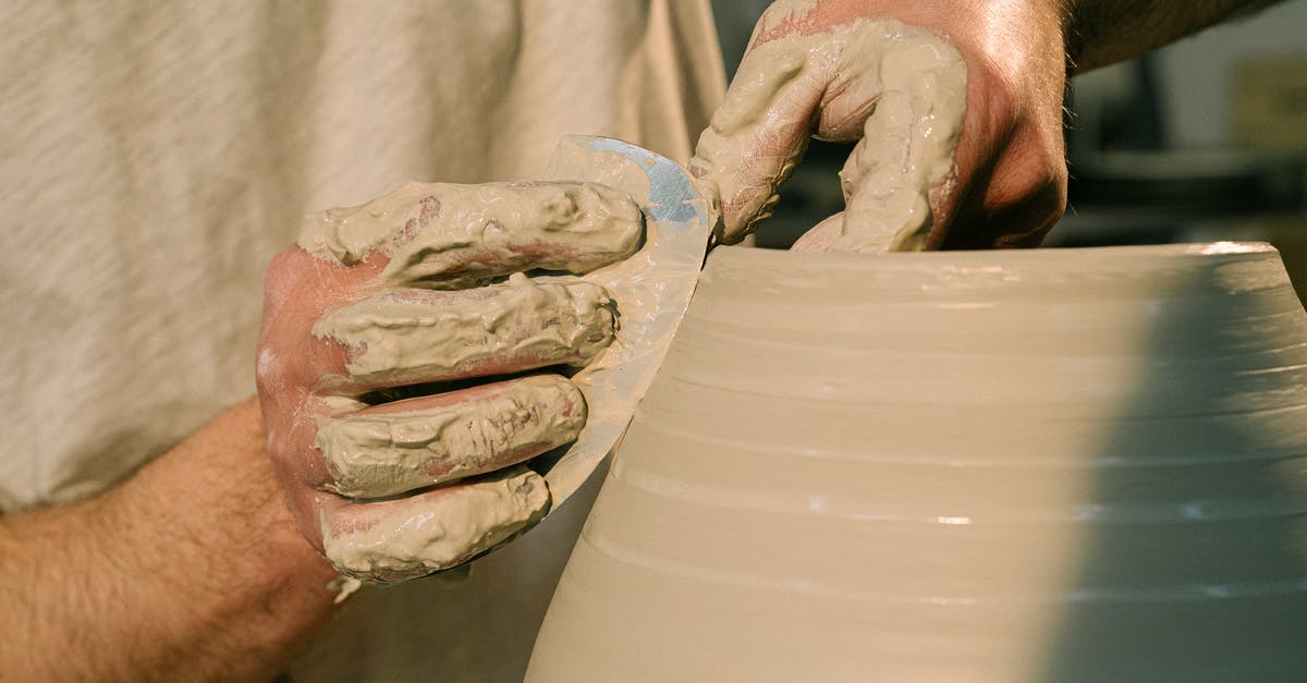 Pot making popping noises - Close-Up Shot of a Person Molding a Clay Pot