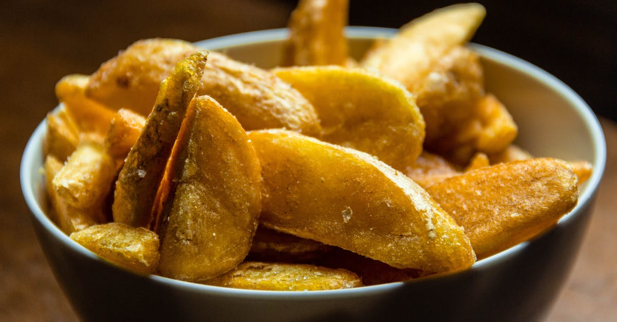 Potato Crisp making - Close Up Photo of Fried Potato Wedges