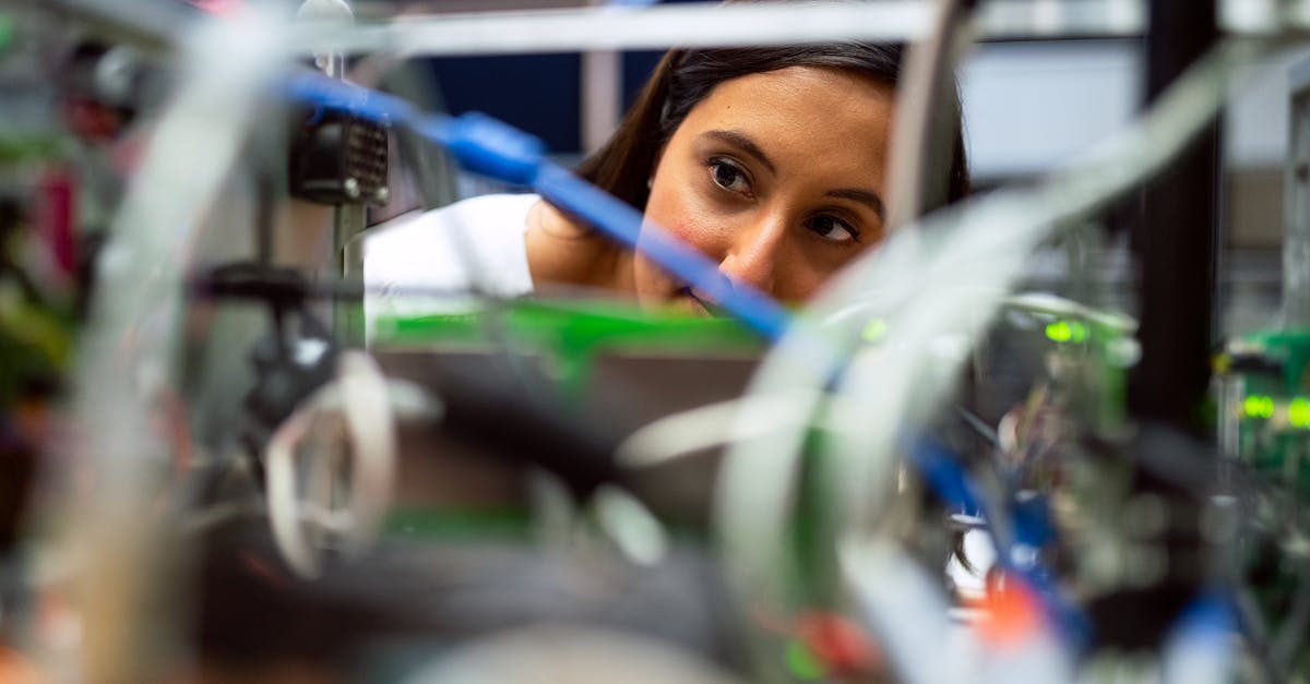 Pot-Roast in Advance - Photo Of Female Engineer Looking Through Wires