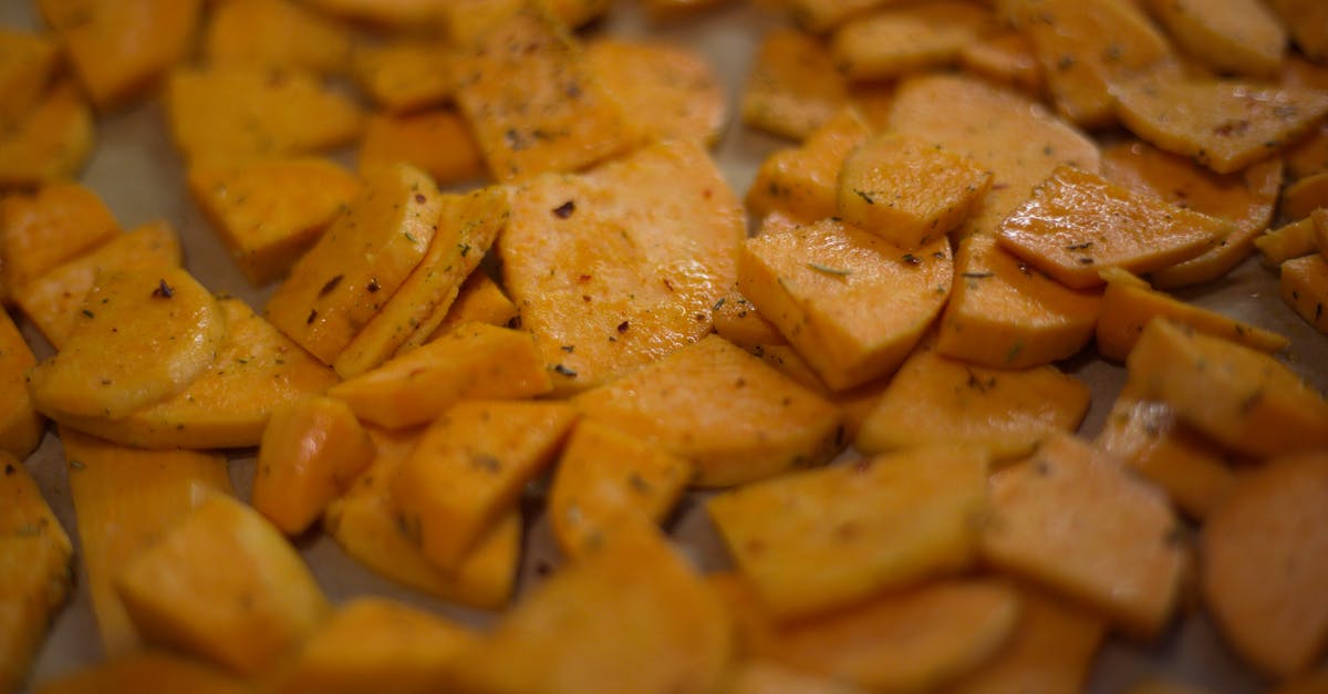 Precooking sweet potato fries for quick warm/serve day of party - Yummy fried batata on white surface