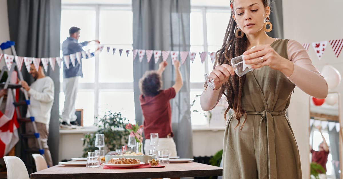 Preparing curries faster - Woman with Dreadlocks Wiping a Wine Glass