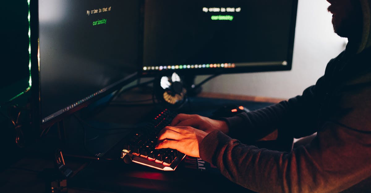 Preparing minced garlic the night before using them - Crop hacker silhouette typing on computer keyboard while hacking system