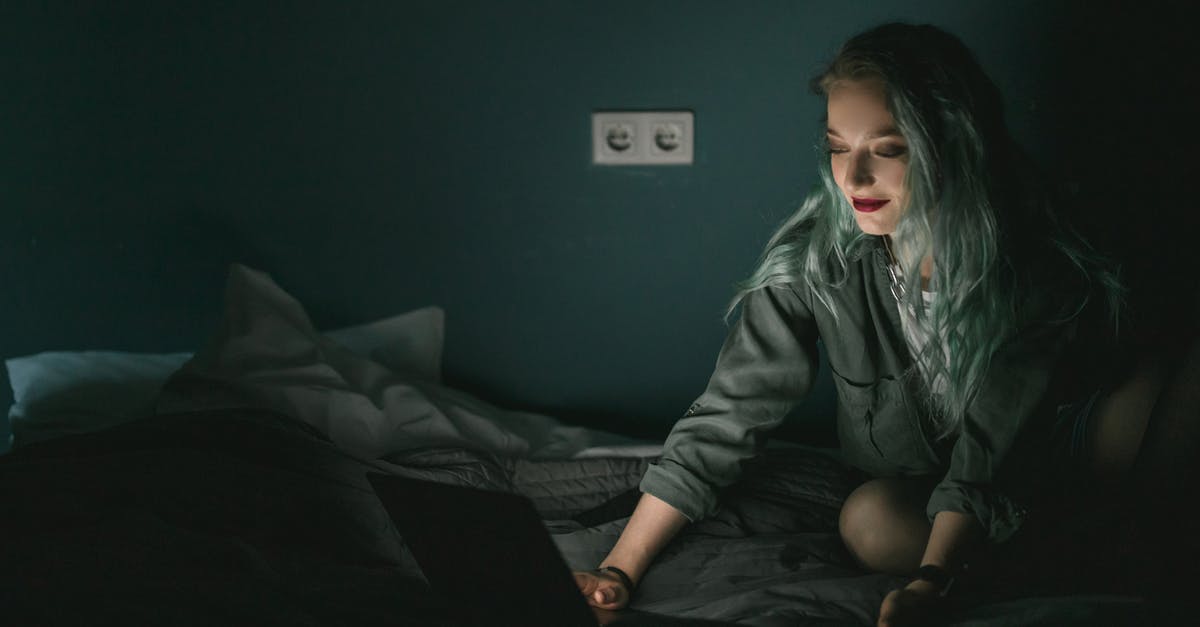 Preparing minced garlic the night before using them - Woman Using Laptop in the Dark