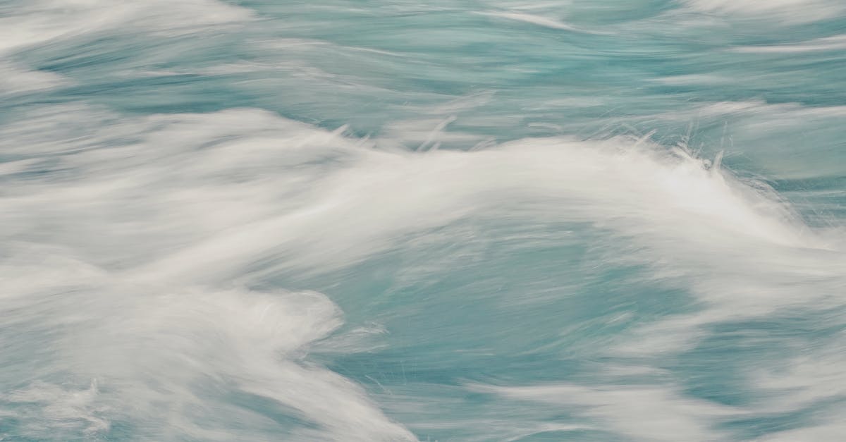 Preparing Salsa Verde fast and fresh - Abstract background of clear waves of sea rolling fast creating white foam in motion