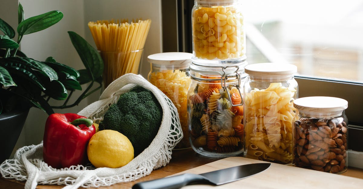 Preparing/Storing freshly made noodles/pasta - Assorted vegetables placed on counter near jars with pasta