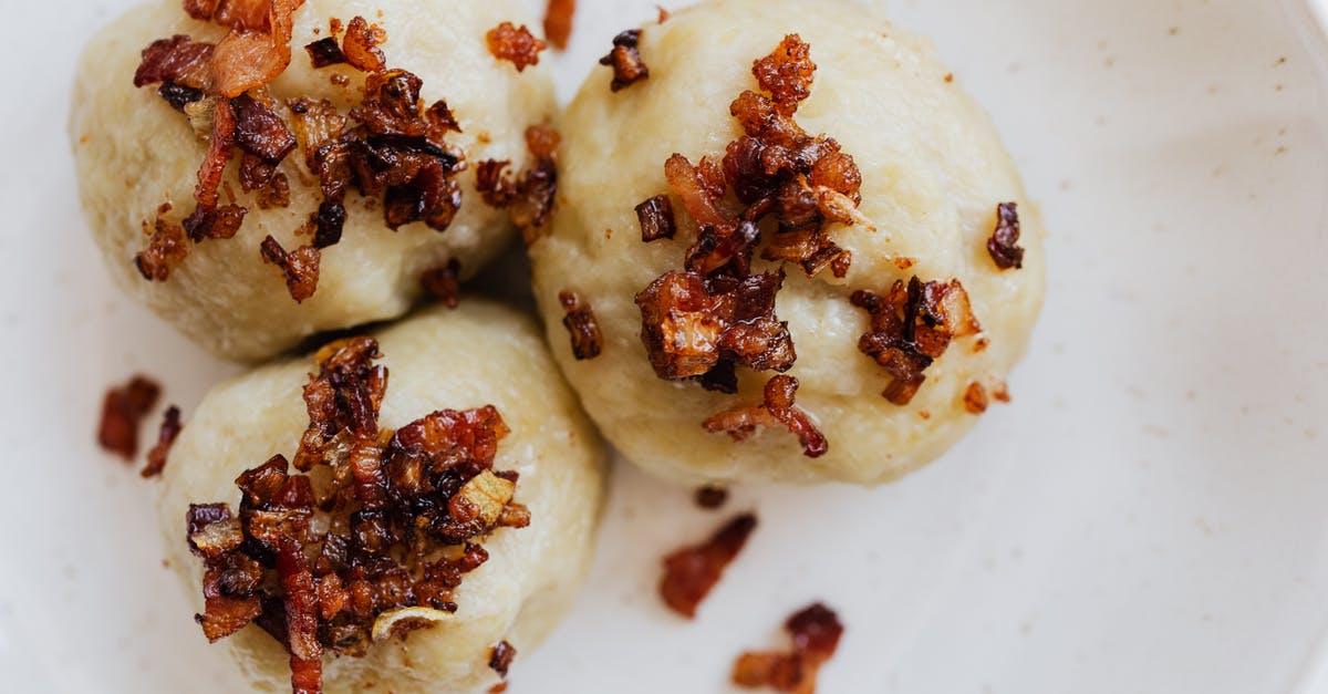 Pre-preparing breakfast scramble -- potatoes - Round cepelinais with bacon served on plate