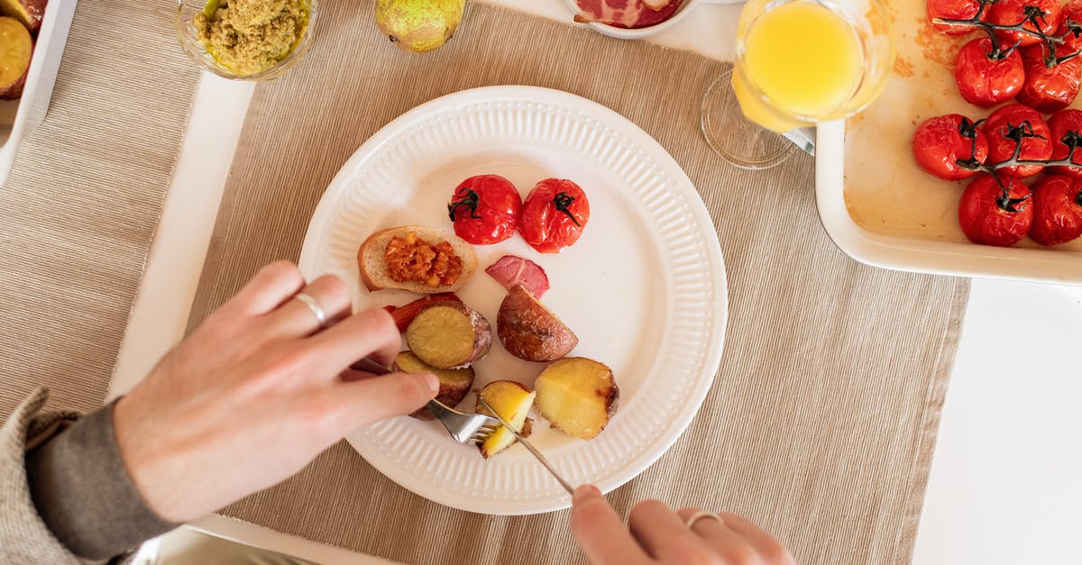 Pre-preparing breakfast scramble -- potatoes - Person Slicing A Potato