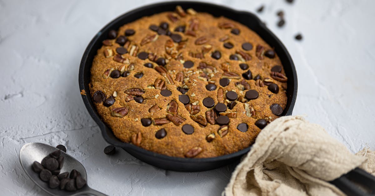 preseasoned pan - now blackened and chipping [duplicate] - A Delicious Pie with Nuts and Chocolate Chips