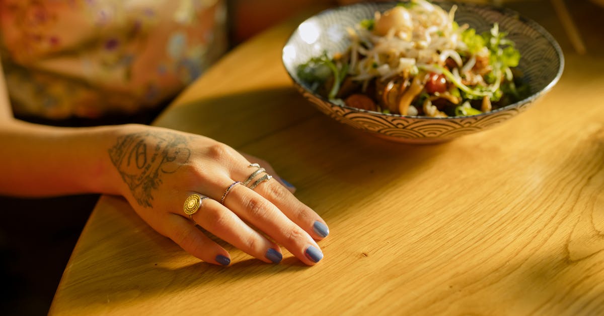 Preserving colour of vegetables in Chinese hakka noodles - Bowl of Noodles on Wooden Table