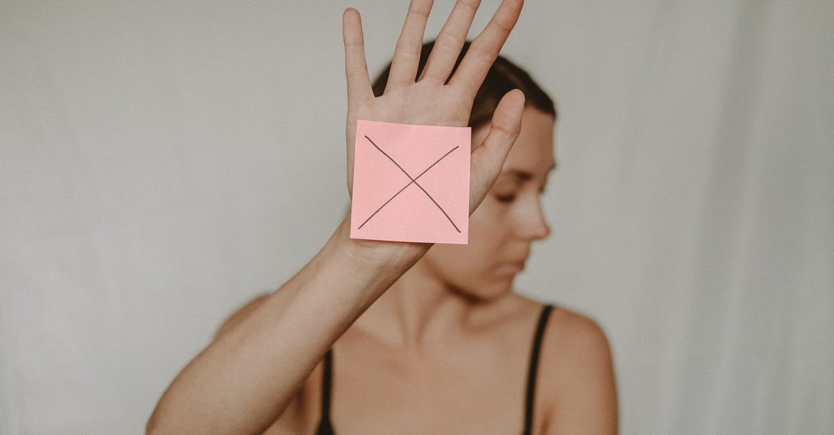 Prevent matcha gelatination [closed] - Woman with paper with cross sign