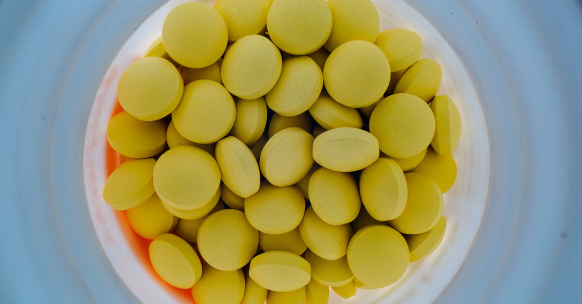 Prevent sticky residue from oiling seasoned pan before storage - Jar of yellow pills from above