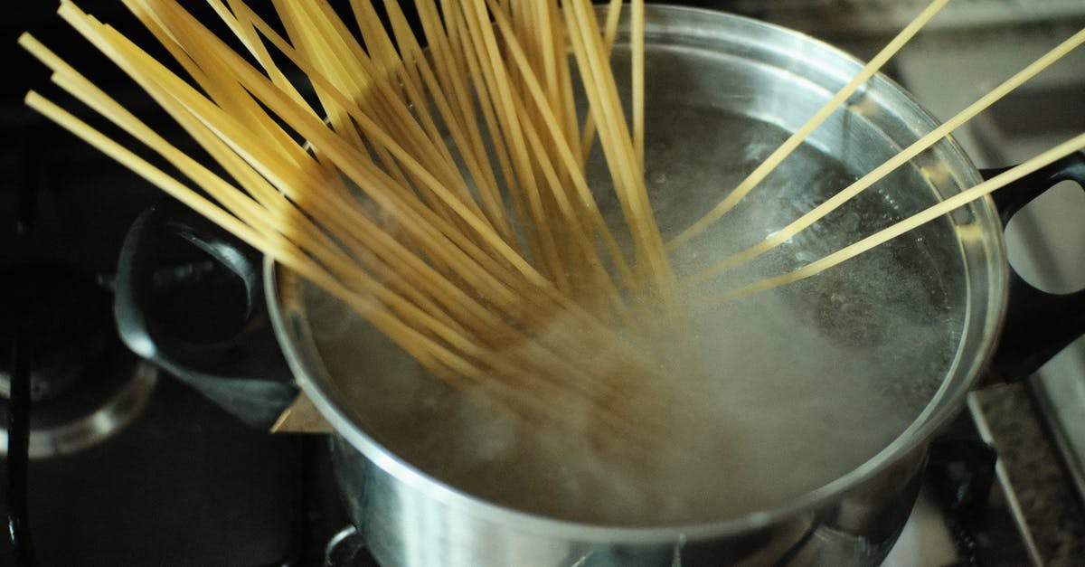 Preventing Noodles from Sticking to the pot - Uncooked Pasta in a Pot with Boiling Water