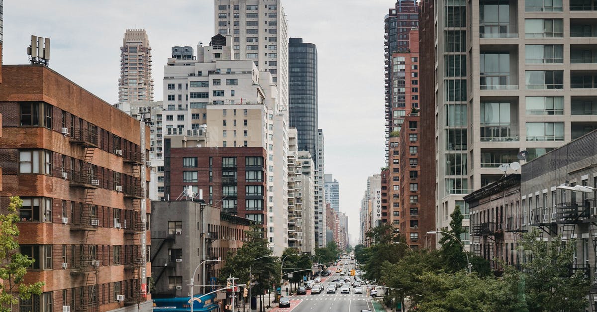 Prime Rib versus New York Strip Roast - New Your City street with vast busy road between contemporary typical buildings on clear day