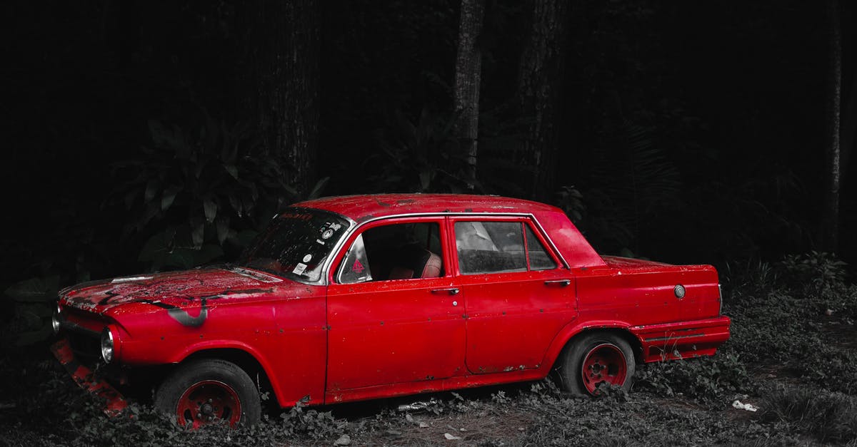 Problem Rolling Out Rough Puff Pastry - Old car with damaged bumper and broken window on grassy ground in forest