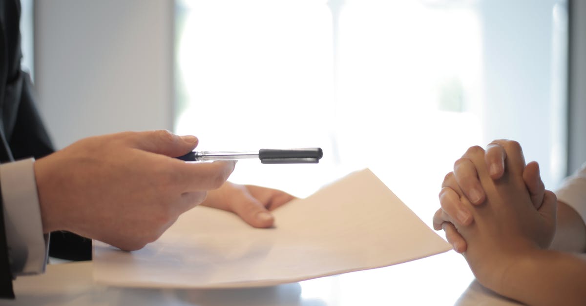 Properties of potassium carbonate as leavening agent - Crop businessman giving contract to woman to sign