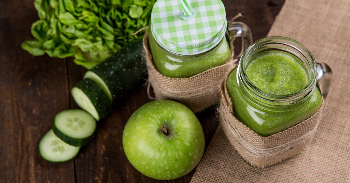 Proportions for improvised cran-apple juice - Green Apple Beside of Two Clear Glass Jars