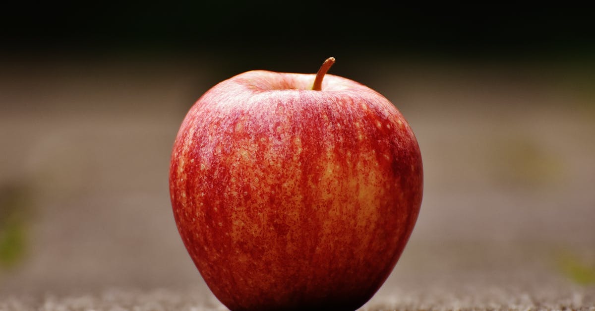 Proportions for improvised cran-apple juice - Shallow Focus Photography of Red Apple on Gray Pavement