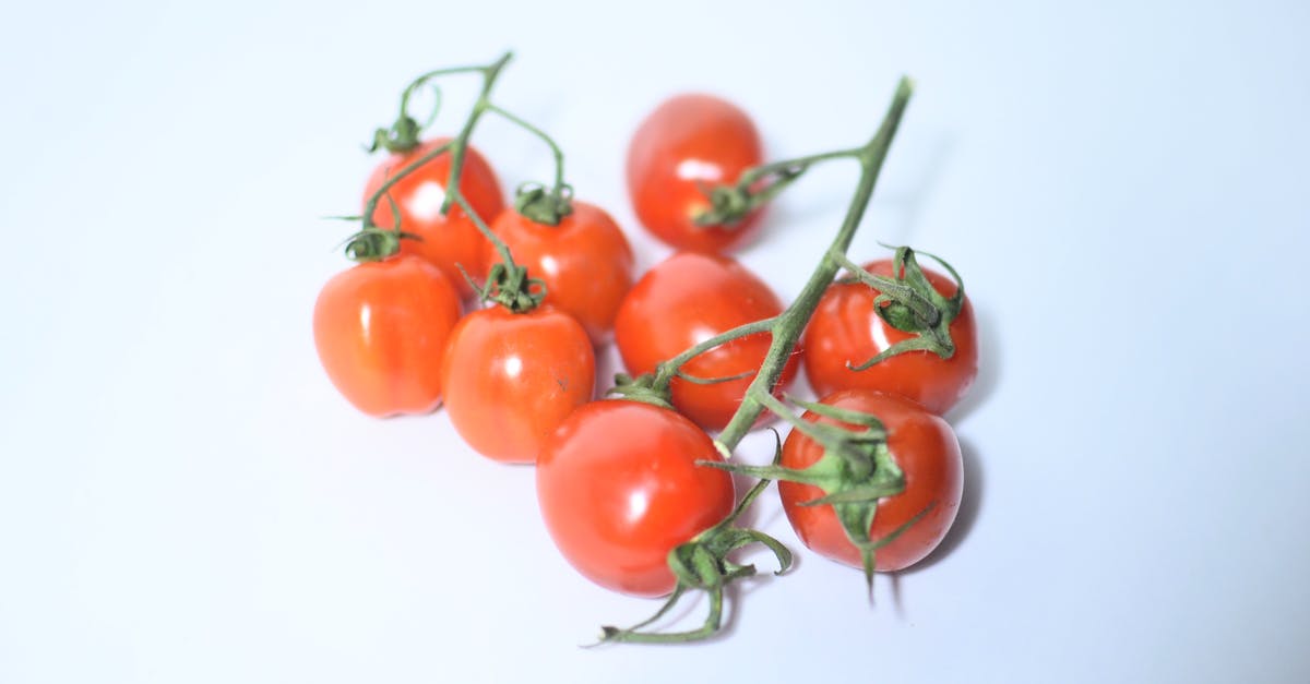 Question about roasting green beans and cherry tomatoes - Ripe tomatoes on green branch