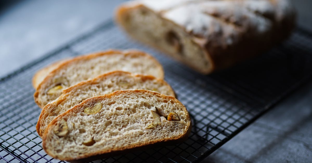 Questions about the how and when of baking homemade sourdough bread - Photo of Baked Bread on Black Metal Tray