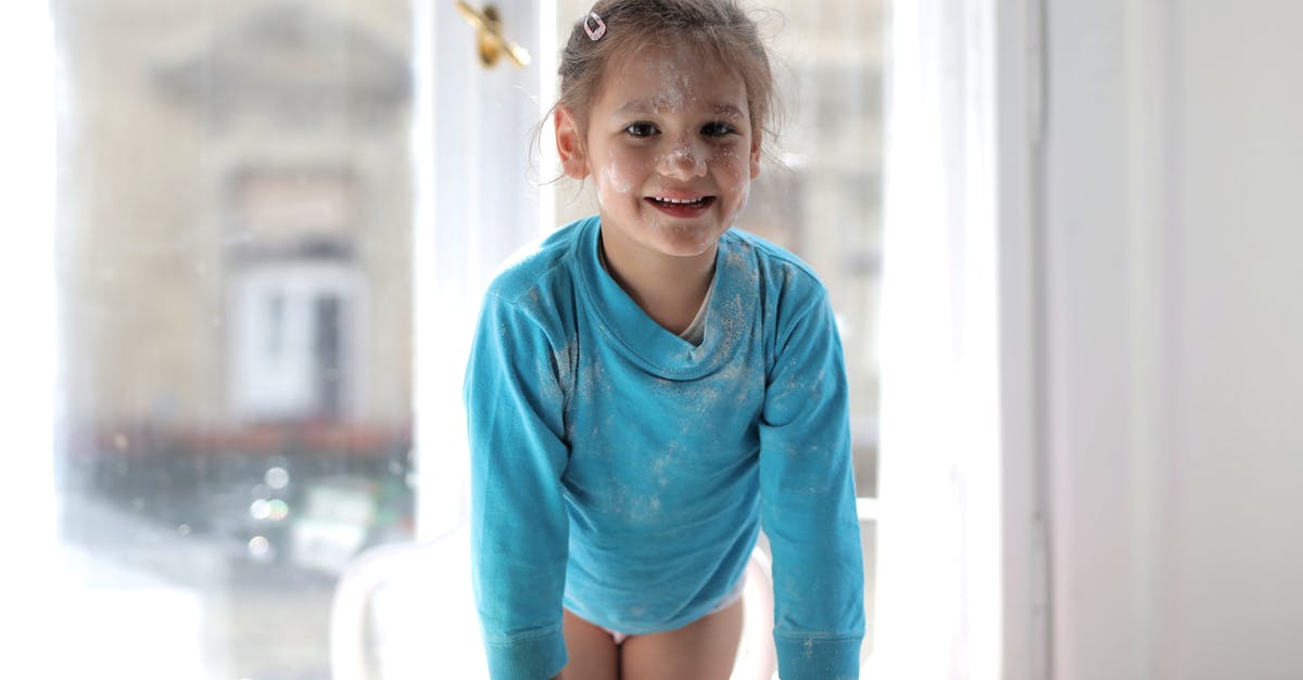 Quinoa flour rusks - Girl in Blue Long Sleeve Shirt Sitting on Brown Wooden Table