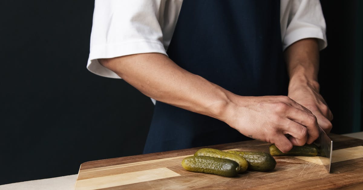 "Post Brine" for Lacto-Fermented Cucumbers (Dill Pickles) - Person Cutting a Cucumber