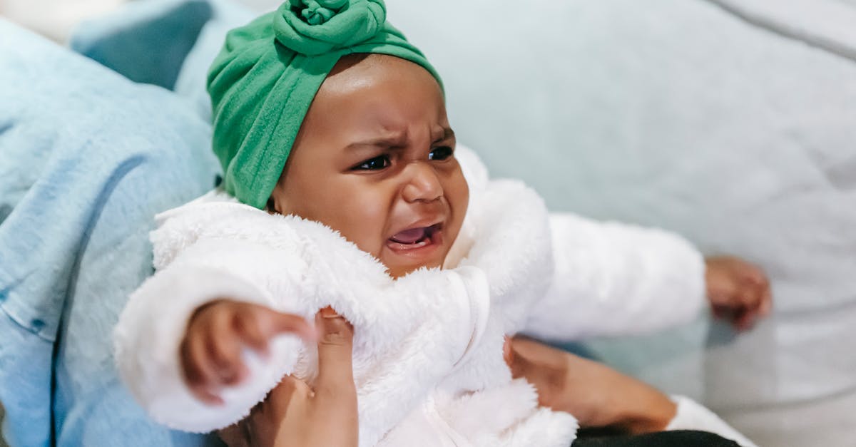 "Screaming" noise while steaming milk? - Crying black baby in turban in mother hands