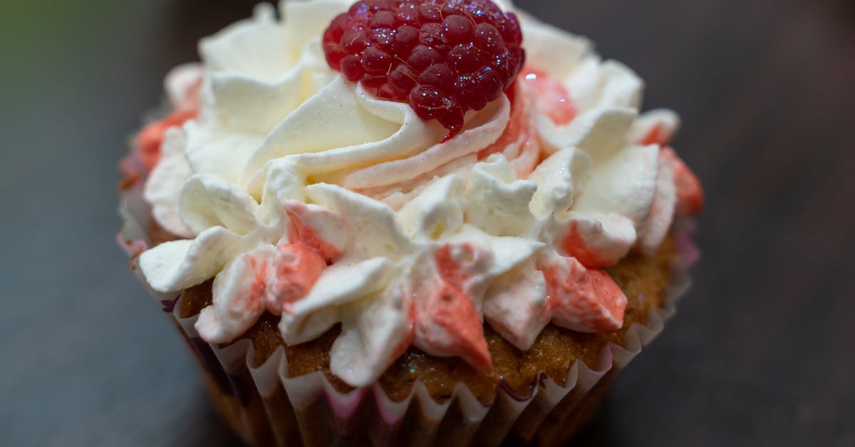 Raspberries too wet in muffin - White and Red Icing Covered Cupcake