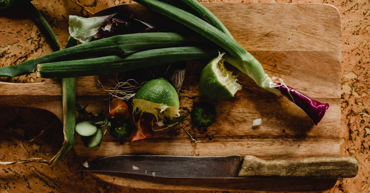 Reasons for Discarding the Core of the Onion When Chopping? - Sliced Lime and Onion Leeks on Wooden Chopping Board