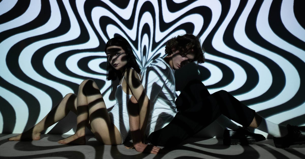 Recreating an accidental crust effect - Two People Sitting Near Black and White Wall