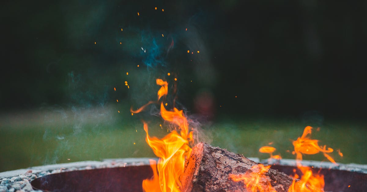 Recreating an accidental crust effect - Sparks from bright orange bonfire in forest