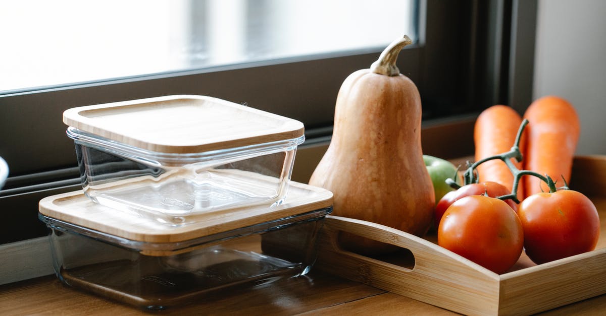 Reducing Canned Pumpkin (as per America's Test Kitchen) - Yummy fresh vegetable including tomatoes carrots and pumpkin placed on kitchen counter near glass jars