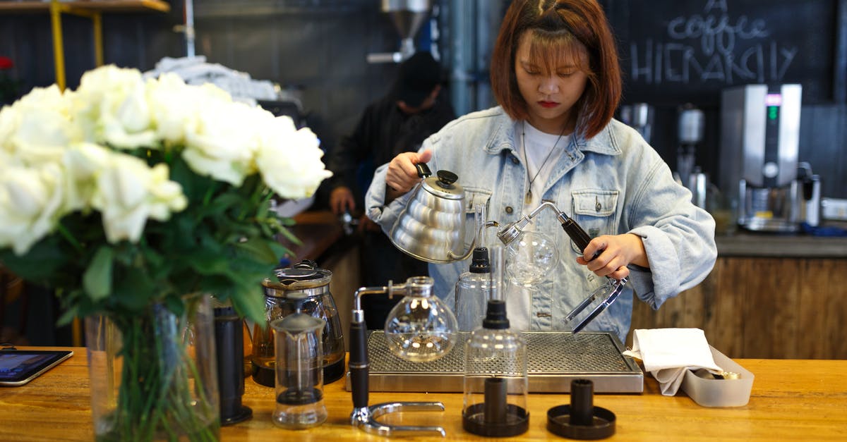 Reducing stock and then adding water - Woman Mixing Beverages