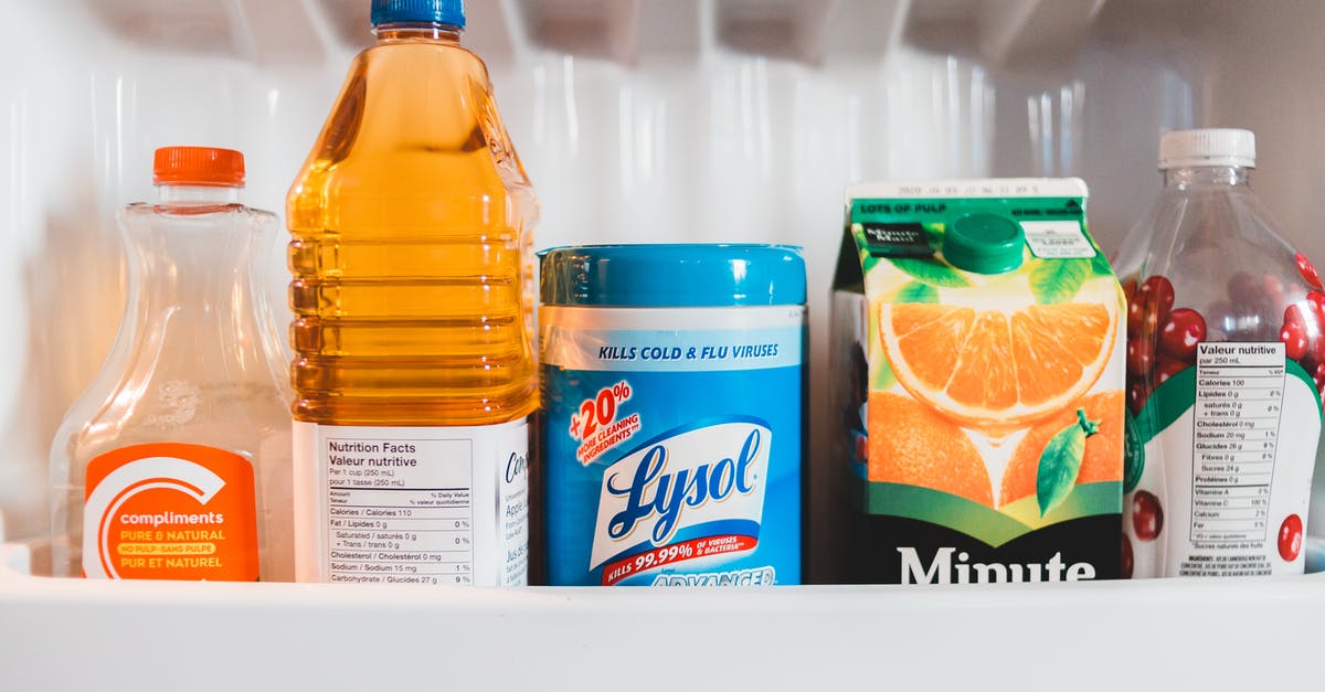 Refrigerating Clam Juice - Bottles with assorted juices in refrigerator