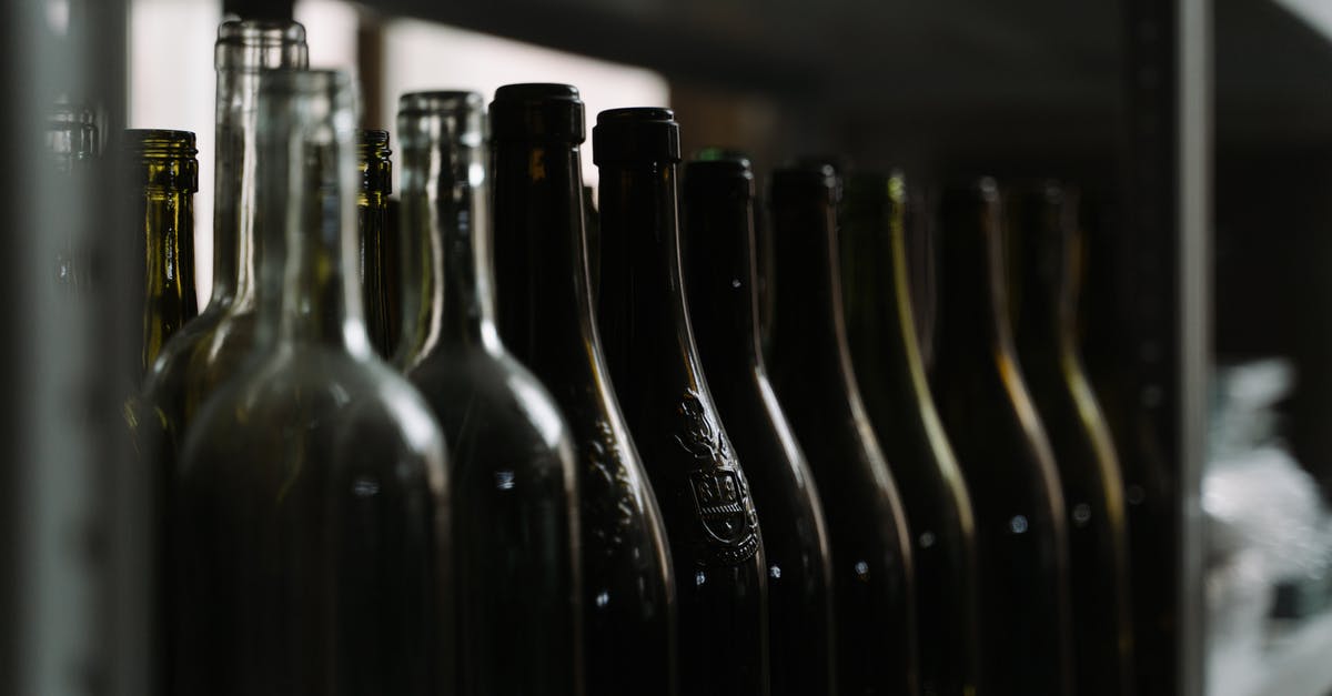 Refrigeration of Cream Liquor - Black Glass Bottles on Table