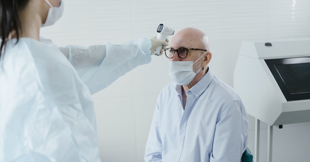 regulating temperature in cheap offset smokers - A Medical Professional Taking the Temperature of a Patient