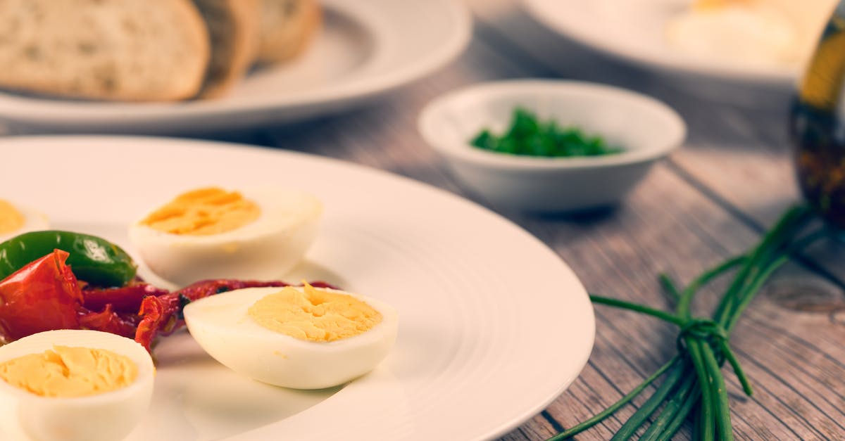 Reheating boiled eggs for scotch eggs - Slices of Hard Boiled Egg on Plate